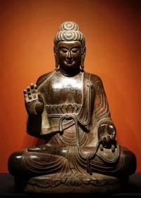 A piece of bluestone painted Buddha statue from the Tang Dynasty