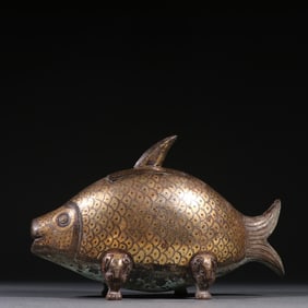 A Han bronze mistake gold and silver fish-shaped aromatherapy ornament