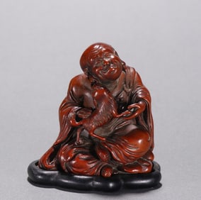 A Qing boxwood carved Arhat ornament