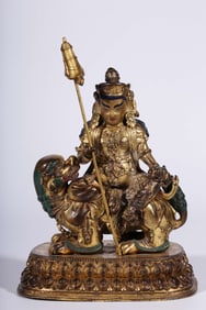 A sitting statue of the king of bronze gilt treasures of the Qing Dynasty