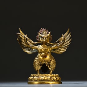 A Qing Dynasty bronze gilt Dapeng Dharma protector ornament