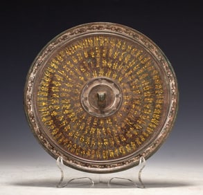 A wrong gold, silver and bronze mirror