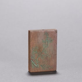 A late Qing agarwood carved plum blossom pendant