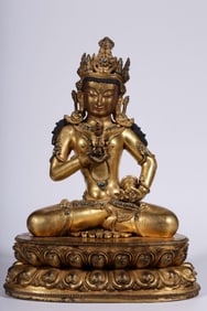 A Qing Dynasty bronze gilt inlaid turquoise Vajrasattva seated statue