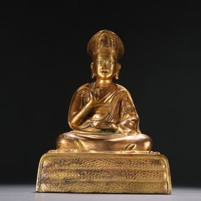 A Qing Dynasty bronze gilt statue of a guru