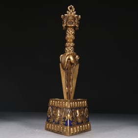 A piece of Tibetan bronze gilt three-sided Pupa Vajra