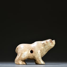 A piece of ancient jade bear carving