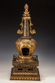 A piece of bronze gilt stupa