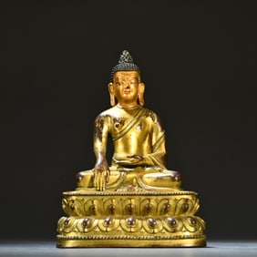 A Qing Dynasty bronze gilt statue of Shakyamuni Buddha