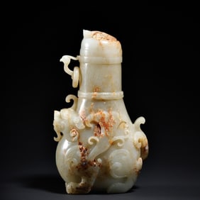 A blue and white jade claw with ring bottle