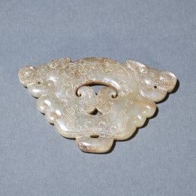 A carving of an ancient jade dragon