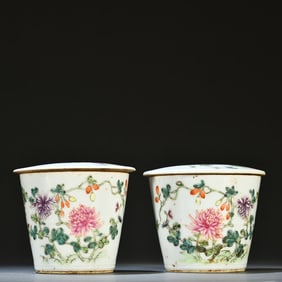A pair of pastel floral-patterned cups