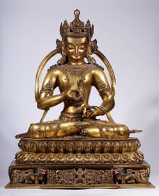 A Qing Dynasty bronze gilt inlaid treasure Vajrasattva seated statue