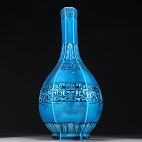 A clear peacock blue glaze is secretly engraved with a double dragon lotus petal pattern