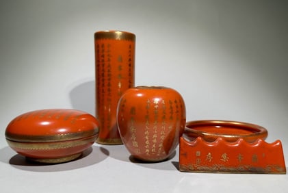 A set of Qing Dynasty coral glaze painted gold poetry and literature pen holder