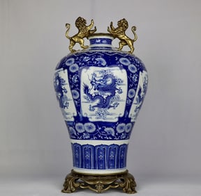 A blue and white windowed dragon motif inlaid with bronze lion amphorae