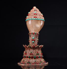 One piece of silver filigree encrusted with gemstone crystal conch