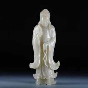 A standing statue of Hetian Jade Guanyin,