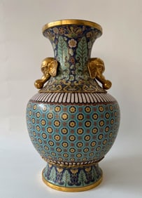 A Qing Dynasty cloisonné turn-in bottle