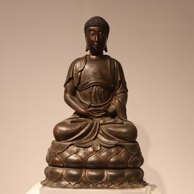 A Ming bronze lacquered gold seated statue of Shakyamuni Buddha