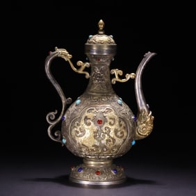 A bronze and silver dragon pattern holding pot