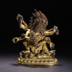 A Qing Dynasty bronze gilt six-armed Mahagala statue