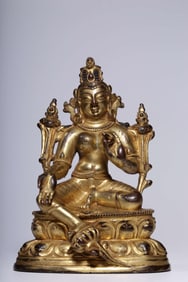 A seated statue of a bronze gilt green Tara from the Qing Dynasty