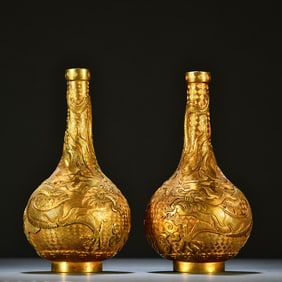 A pair of gilded dragon play pearls to welcome the new year