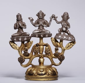 A statue of three Buddhas in silver gilt from the Qing Dynasty
