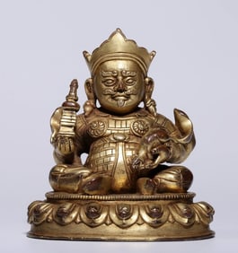 A Qing Dynasty bronze gilt statue of the king of heaven