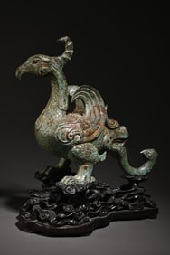 A bronze bird study ornament