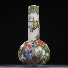 A bottle with a clear tire, enamel flower and bird pattern
