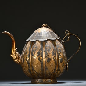 A sterling silver gilt dragon pattern jug