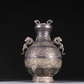 A sterling silver engraved double dragon ear bottle