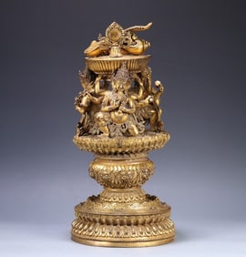 A 15th-century Tibetan bronze gilt altar ornament