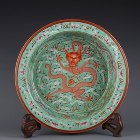 An Exquisite Qing Qianlong year green pastel nine dragon pattern folded along the basin