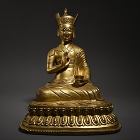 A bronze gilt Tibetan Buddha statue study ornament