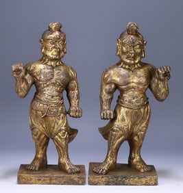 A pair of bronze gilt wrestlers