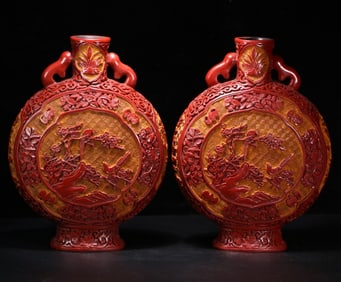 A pair of lacquerware red moon bottles