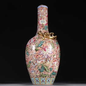 A dragon bottle with a clear sail red painted gold pastel floral pattern