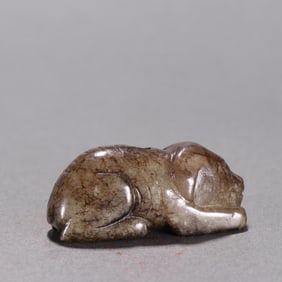 A Ming Hetian jade dog pendant