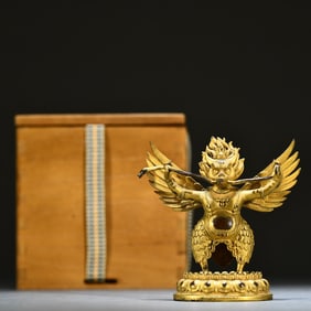 A Qing Dynasty bronze gilt Dapeng Dharma protector ornament