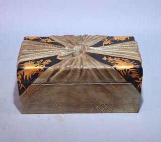 A large lacquer painted gold jewelry box