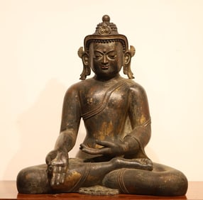 A Qing Dynasty bronze lacquer gold statue of Sakyamuni