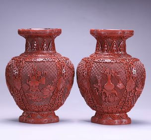 A pair of Qing Dynasty red flower bottles