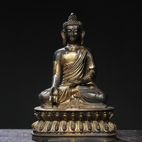 A bronze gold Amitabha Buddha statue