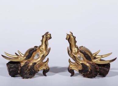 A pair of Qing Dynasty bronze gilt dragon head ornaments