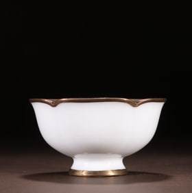One piece of white glaze covered with gold cups