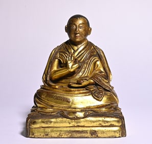 A bronze gilt Tibetan Buddha statue study ornament