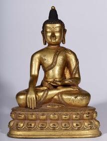 A Qing Dynasty bronze gilt Buddha seated statue